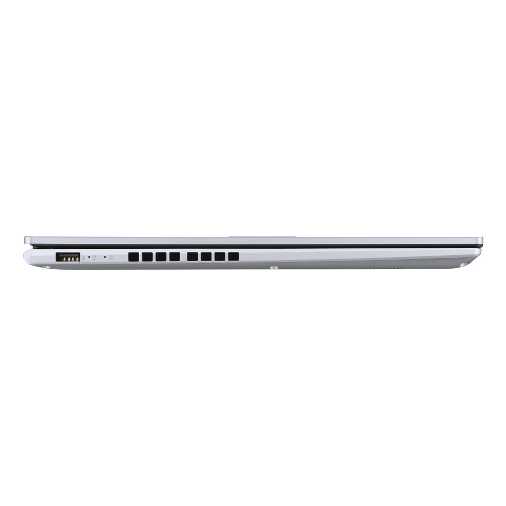 Srebrny laptop z boku, pokazujący porty i smukły profil.