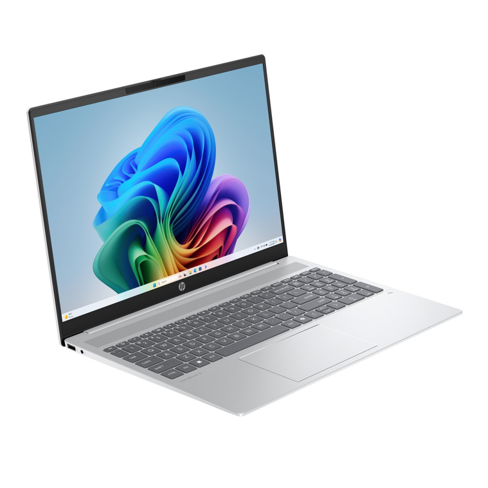 Srebrny laptop HP z kolorową tapetą systemu Windows.