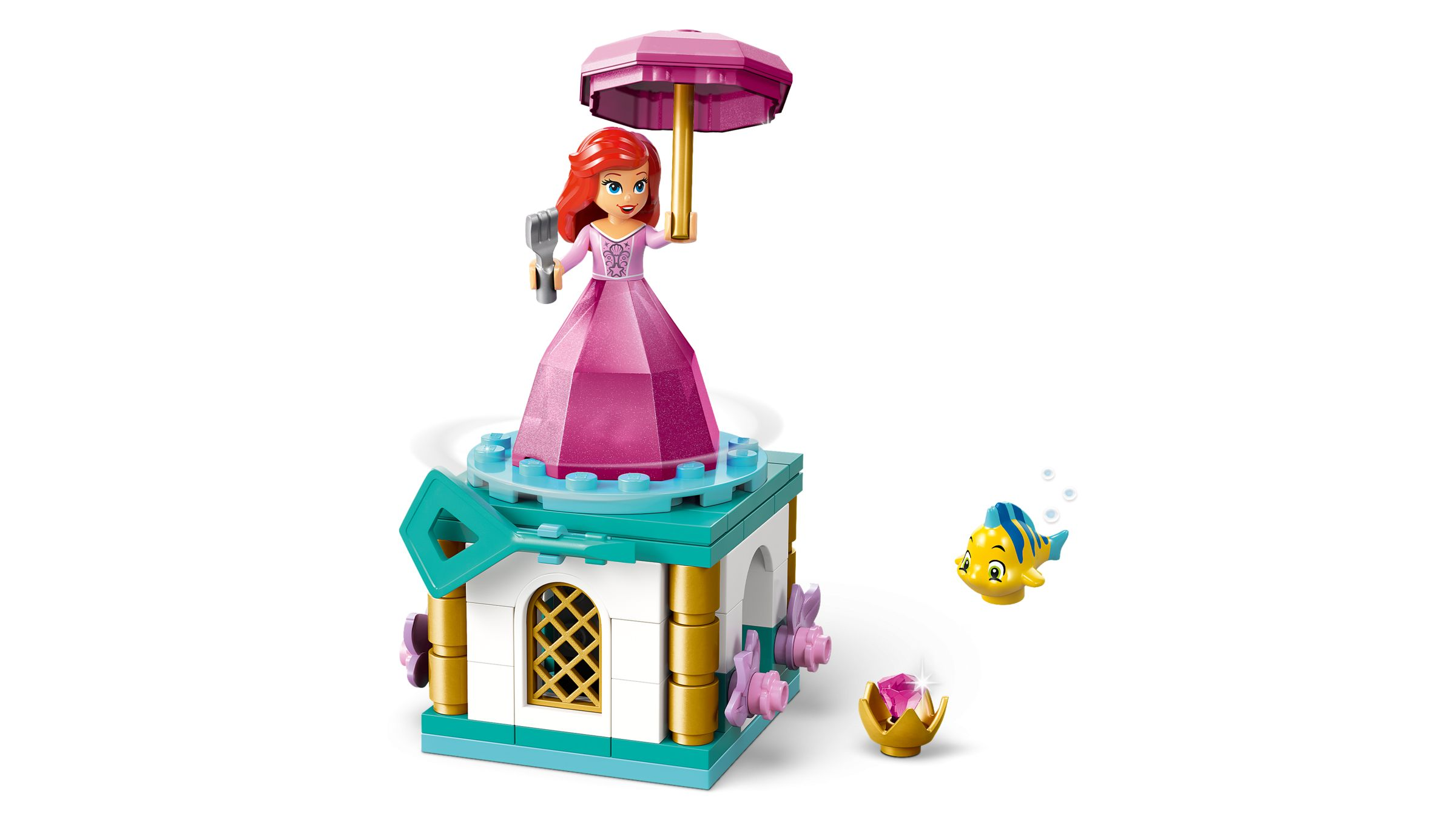 Ariel-Figur mit pinkem Kleid und Sonnenschirm auf einem turmartigen Gebilde.