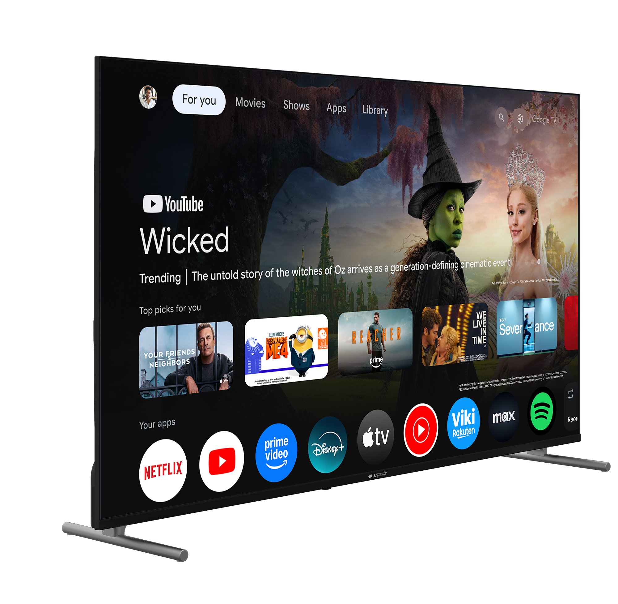 Akıllı TV, film ve uygulamalarla Google TV arayüzünü gösteriyor. Solda yeşil bir cadı, sağda bir prenses var.