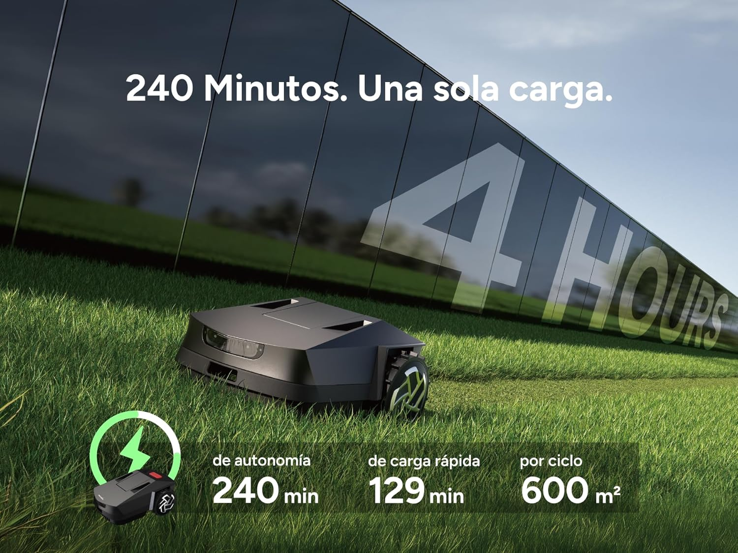 Un robot cortacésped negro sobre césped verde con pared de cristal al fondo.