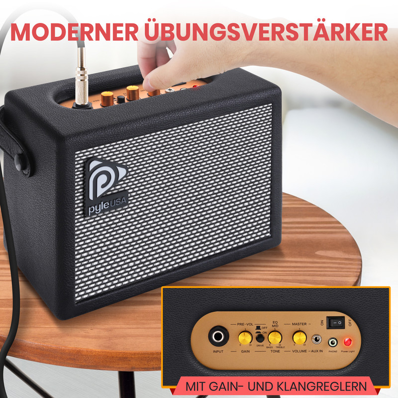 Ein schwarzer Gitarrenverstärker mit silbernem Gitter und Bedientasten.