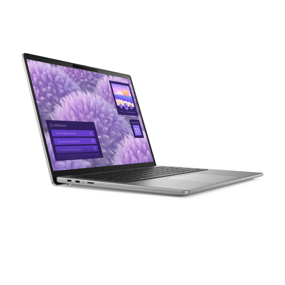 Otwarty laptop wyświetlający fioletową tapetę z chmurami i powiadomienia.