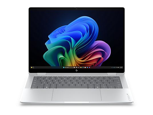 Un laptop argento con uno sfondo astratto colorato sullo schermo.