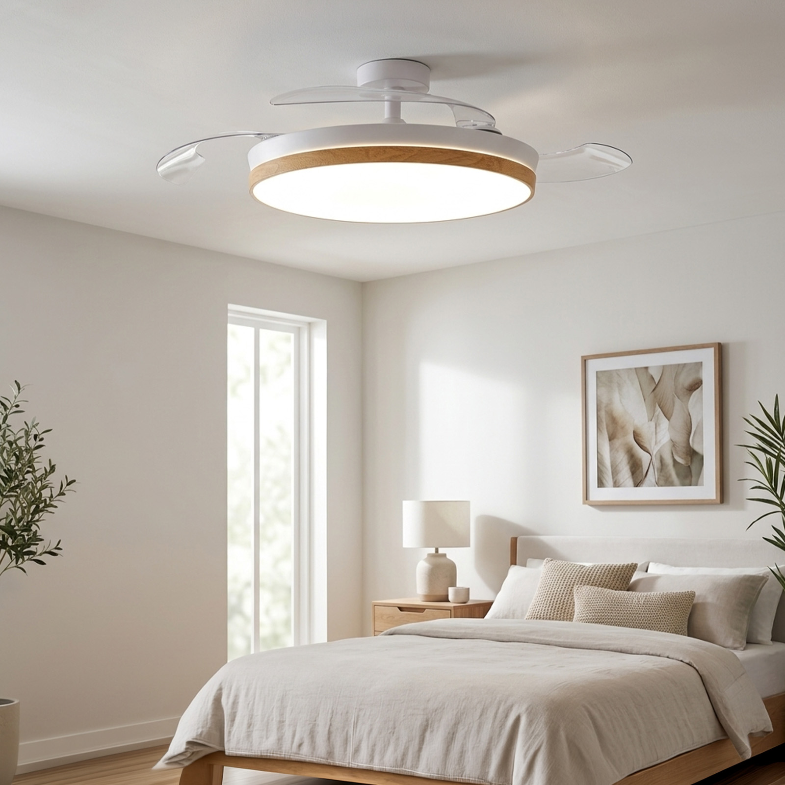 Un dormitorio con una cama, un ventilador de techo con luz y una mesita de noche.
