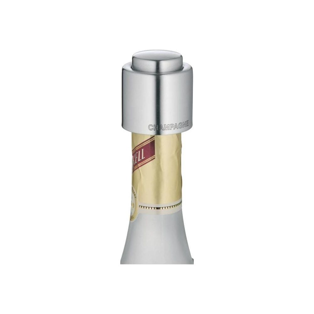 Champagnerverschluss auf einer Flasche mit goldenem Etikett.