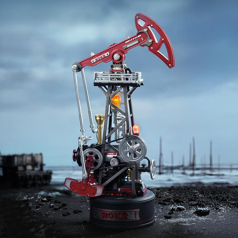Dişliler ve ışıklar içeren detaylı kırmızı petrol sondaj pompası modeli.