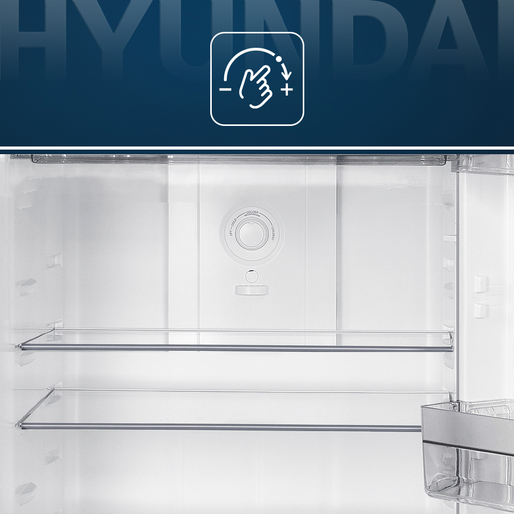 Vista interior de un refrigerador vacío con control de temperatura y estantes.