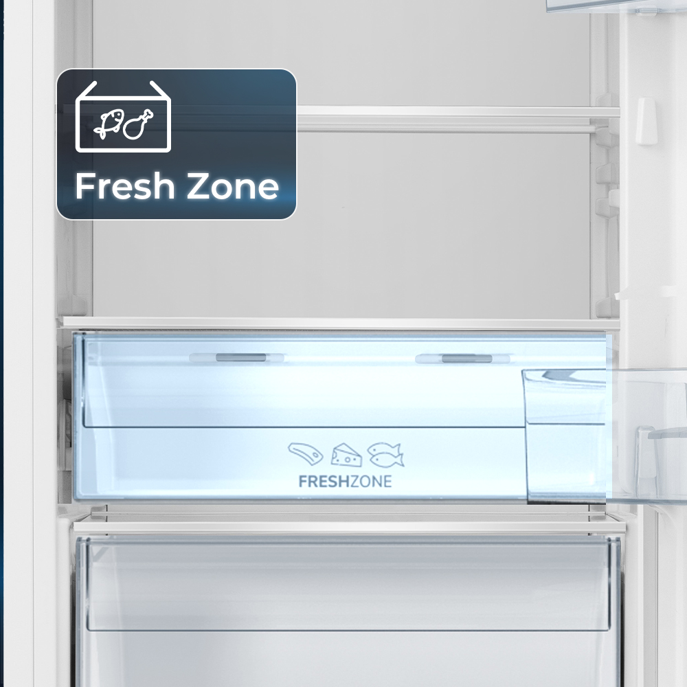 Compartimento de refrigerador con etiqueta "Fresh Zone" e iconos de pescado y queso.