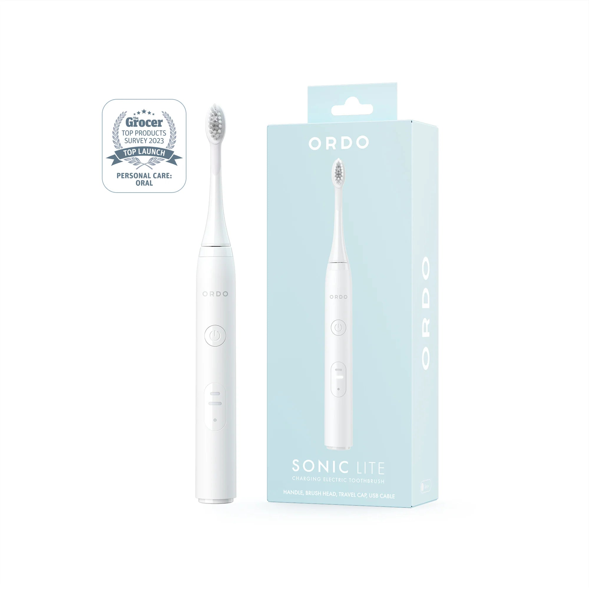 Cepillo de dientes eléctrico blanco con caja, premio y accesorios.