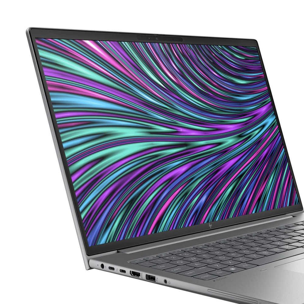 Otwarty laptop wyświetlający kolorową, abstrakcyjną tapetę na ekranie.