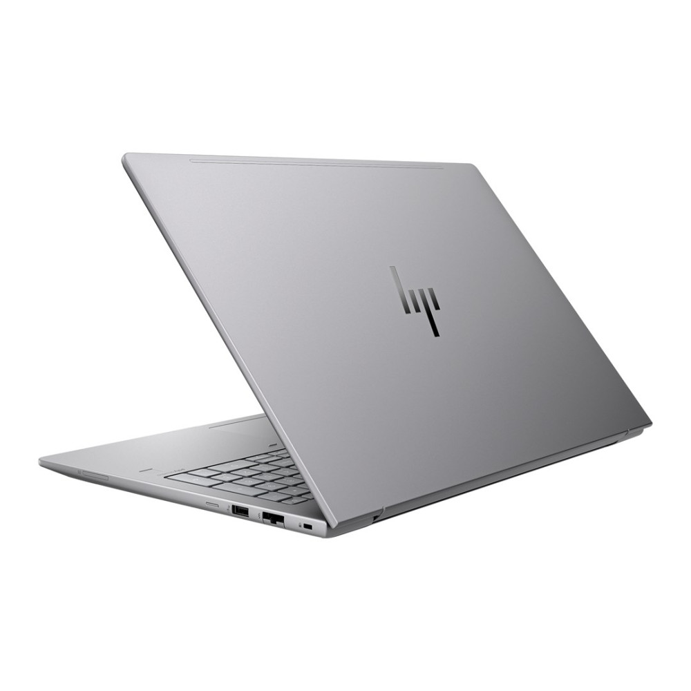 Srebrny laptop z otwartą pokrywą, widoczna klawiatura.