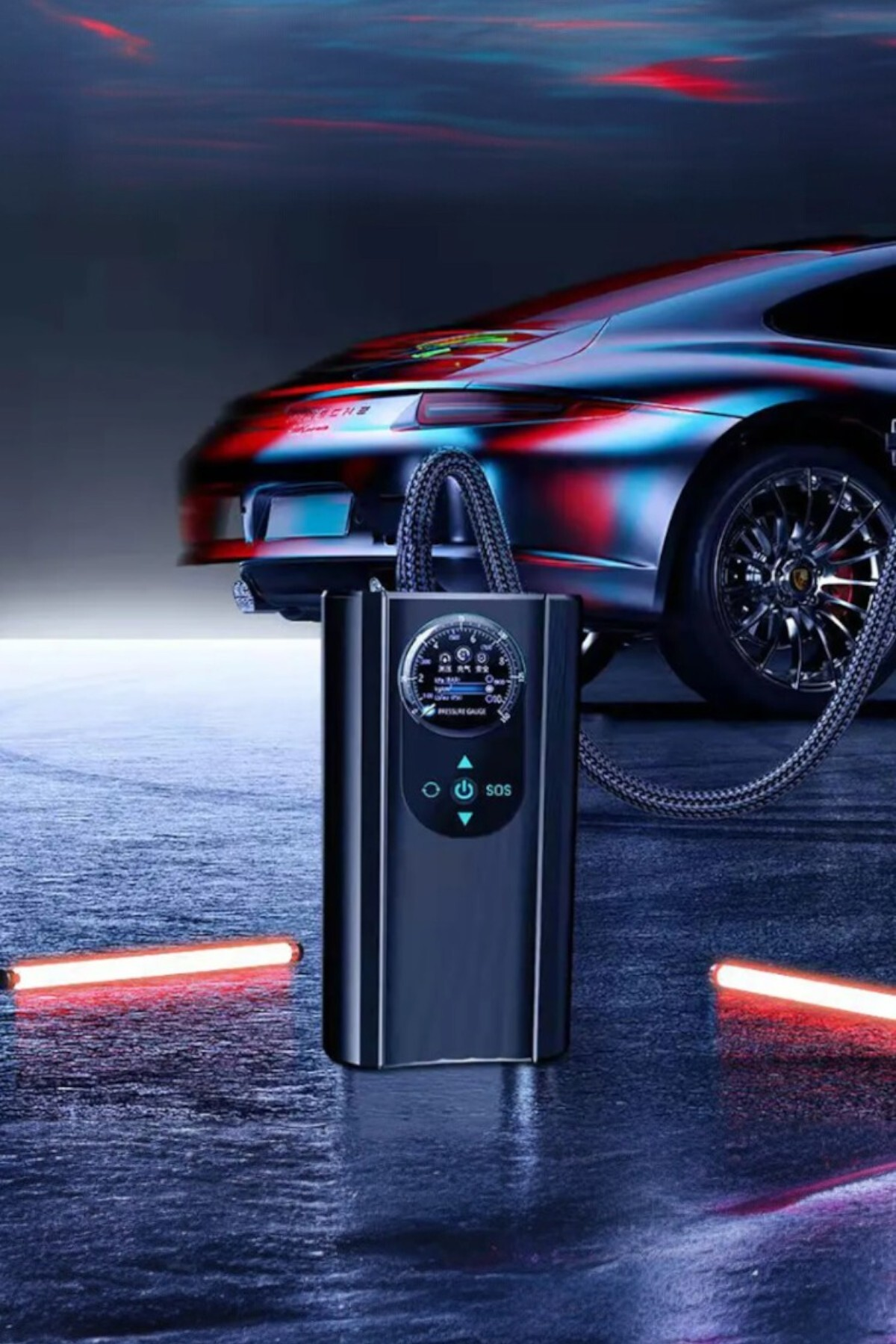 Dijital ekranlı taşınabilir lastik şişirme cihazı, şık ve renkli bir Porsche'nin önünde duruyor.