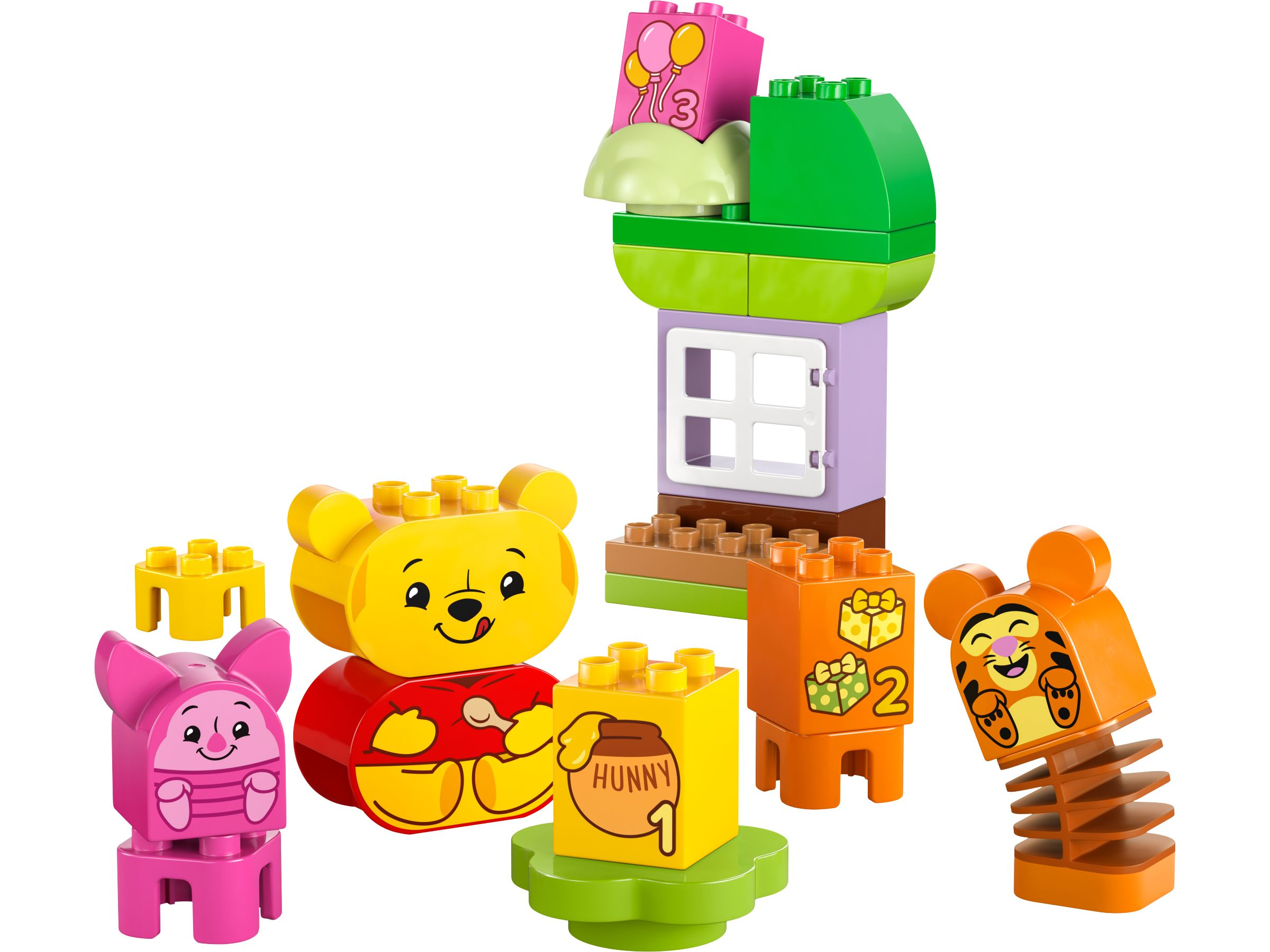Winnie Puuh, Ferkel und Tigger als Duplo-Figuren mit Haus und Geschenken.