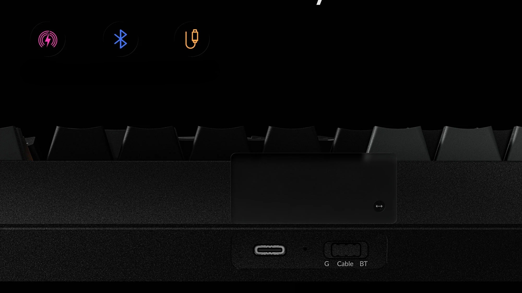 Czarna klawiatura z trzema ikonami na górze: zasilanie, Bluetooth i USB-C.