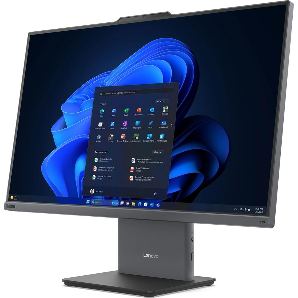 Un monitor Lenovo mostra Windows 11 con sfondo blu e menu Start aperto.