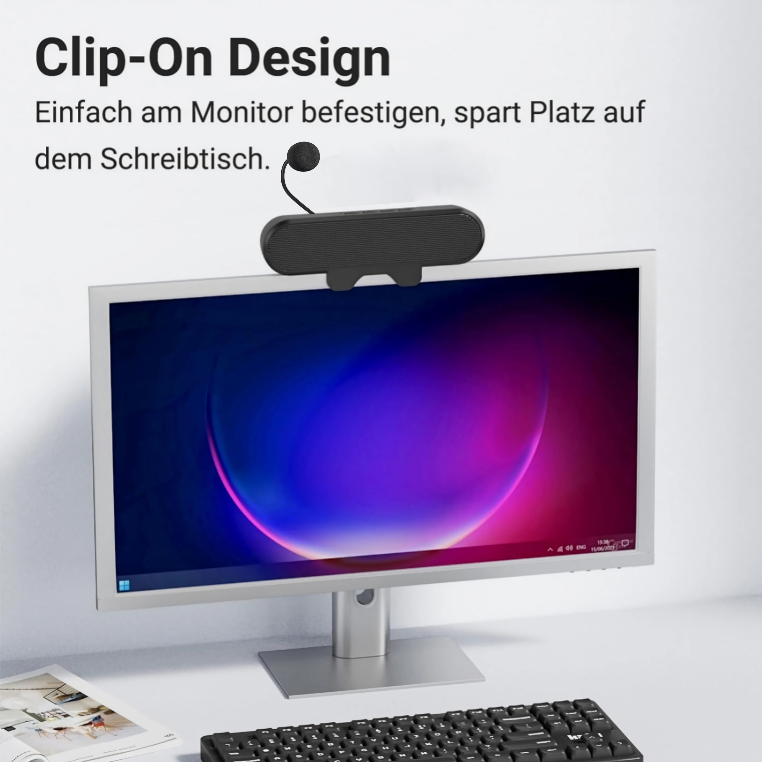 Schwarzer Monitor-Aufsatz mit Lautsprecher, über dem Bildschirm befestigt.
