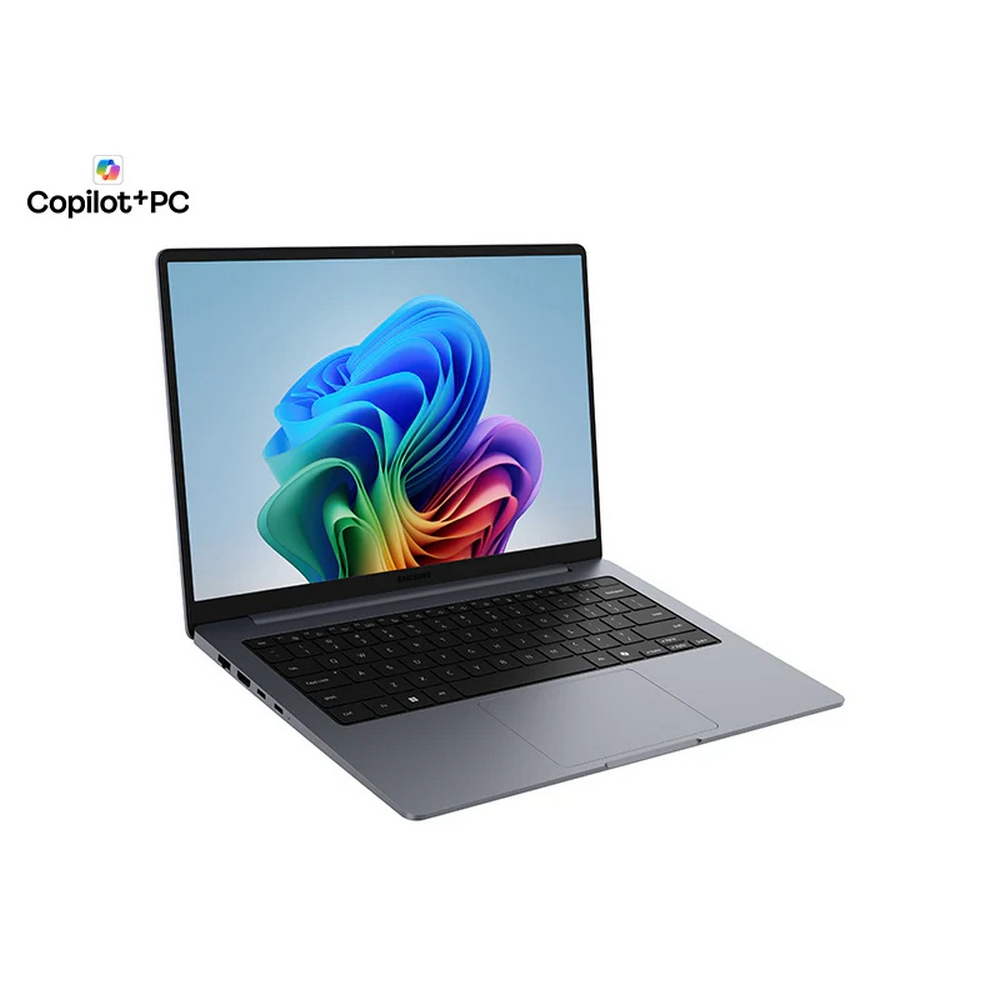 Un laptop grigio con uno sfondo colorato sullo schermo.