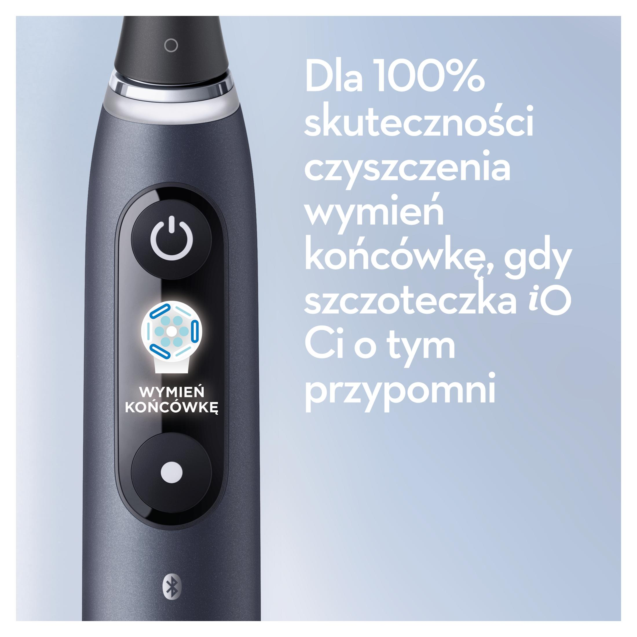 Dunkle Zahnbürste mit Power-Button, Ladeanzeige und Bluetooth-Symbol.