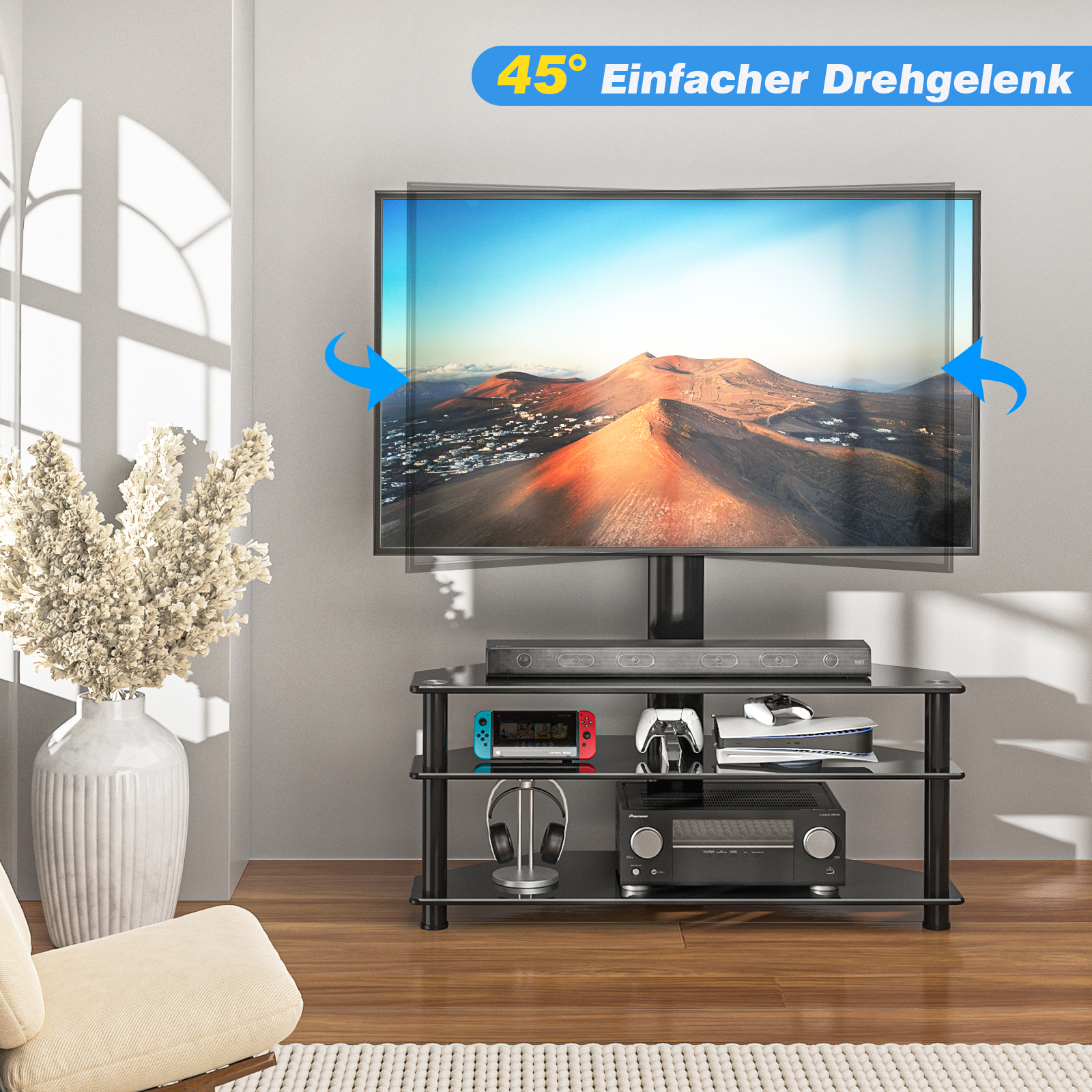 Ein Fernsehständer mit einem Fernseher, der ein Bergpanorama zeigt. Unten sind Spielekonsolen und ein Verstärker.