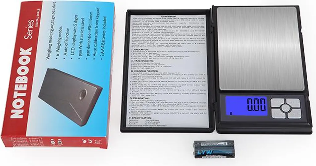 Eine digitale Waage mit Anleitung und Batterien.