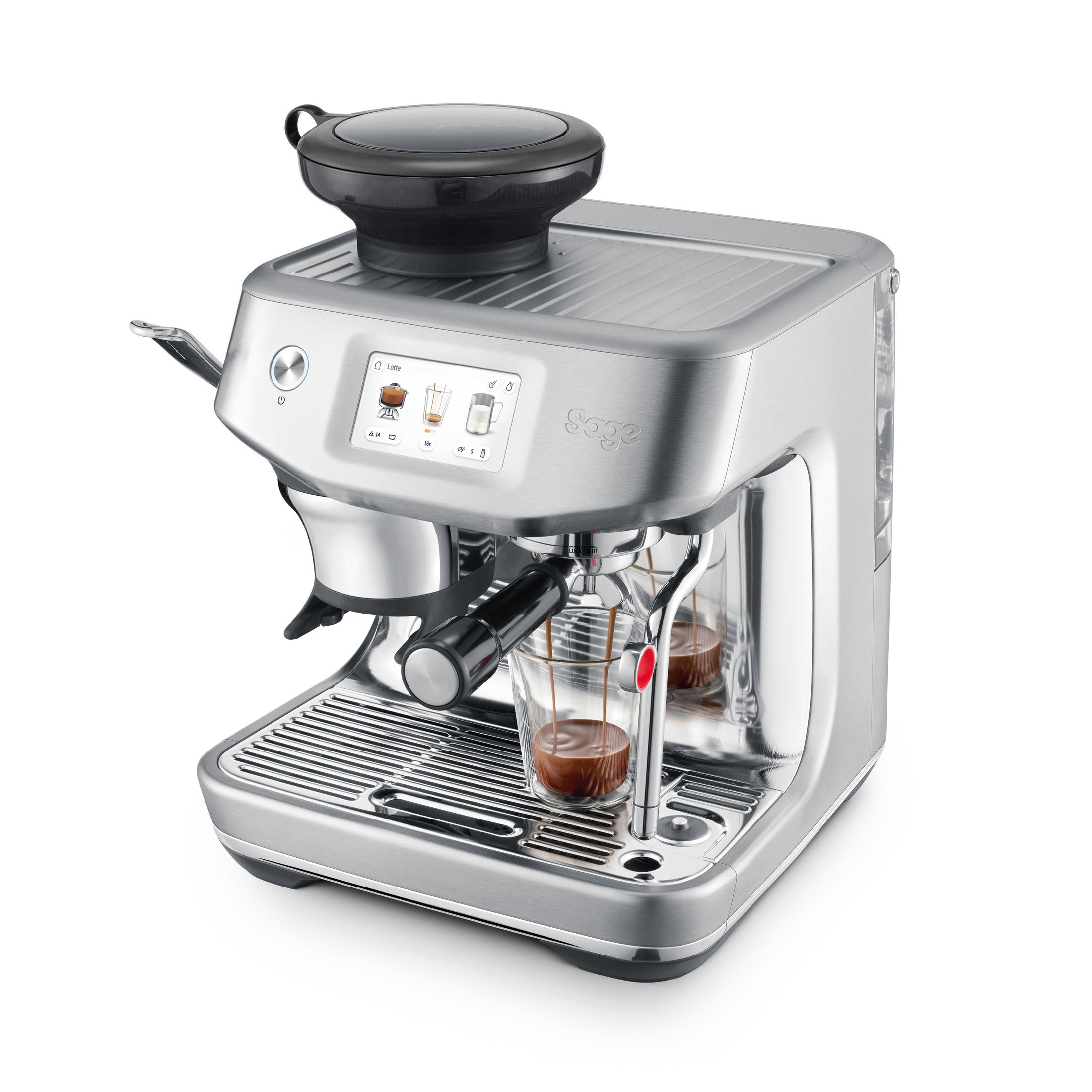Una macchina per espresso argentata sta preparando il caffè in due bicchieri trasparenti.