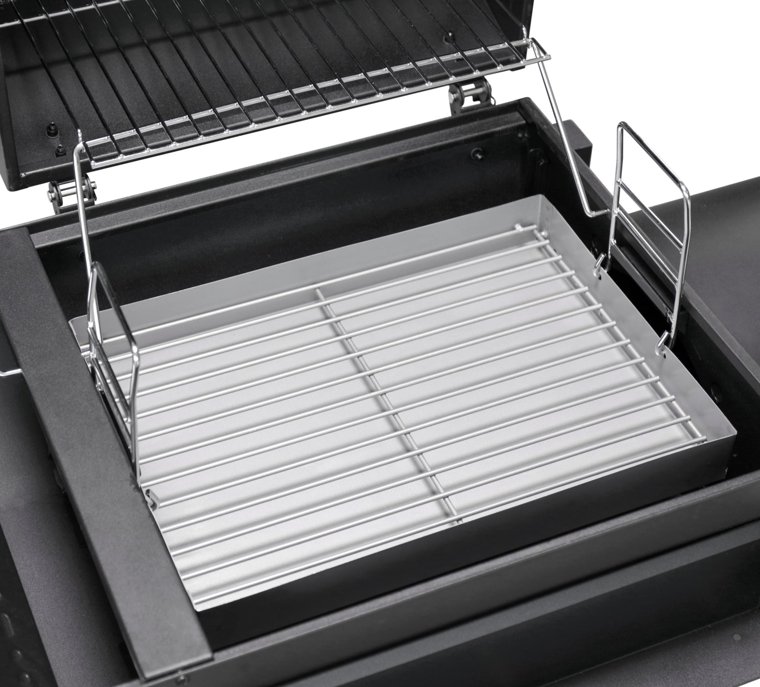 Ein leerer Grillrost aus Metall mit silbernen Stäben auf einer schwarzen Unterlage.