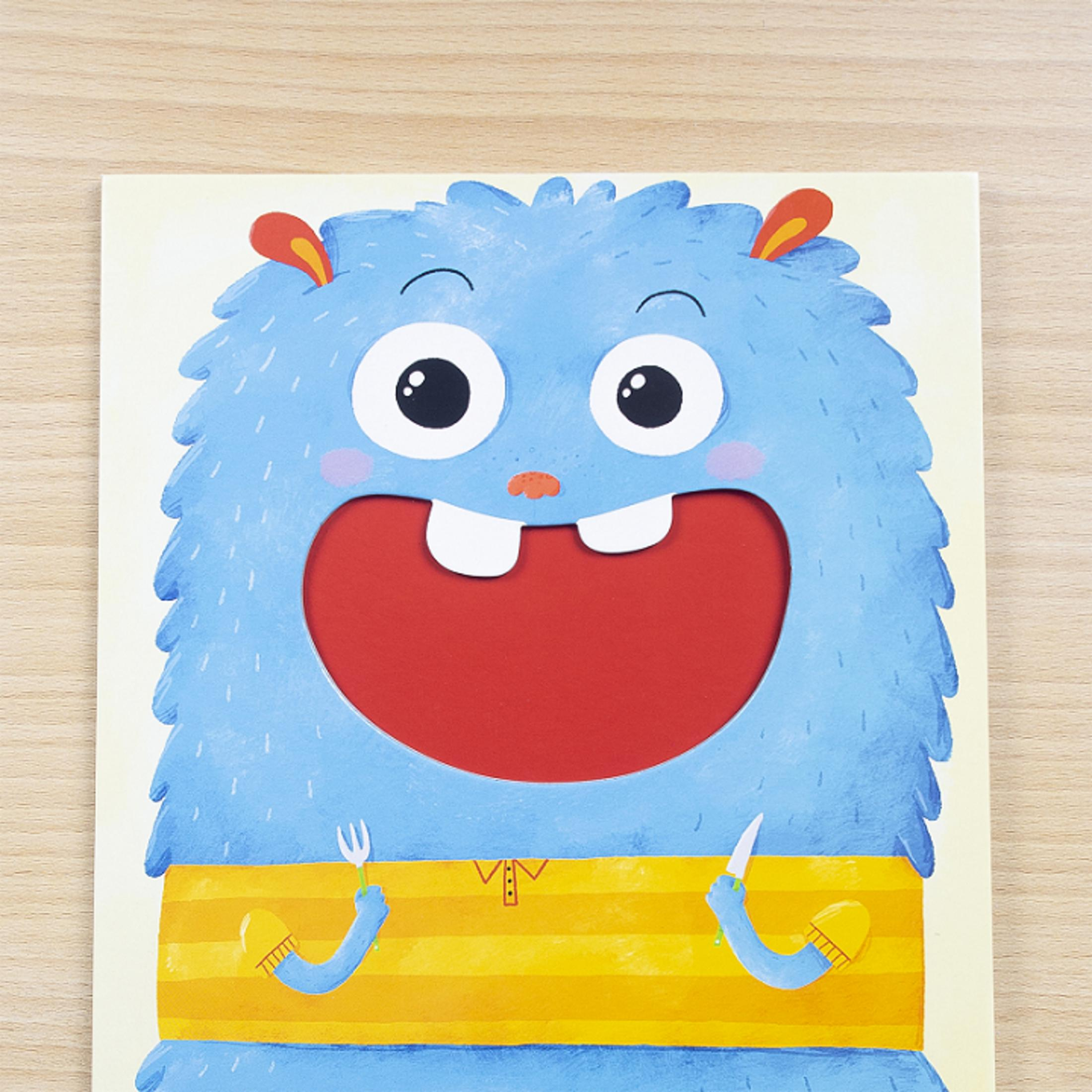 Ein blauer Monsterdruck hält Gabel und Messer, mit gelbem gestreiftem Hemd.