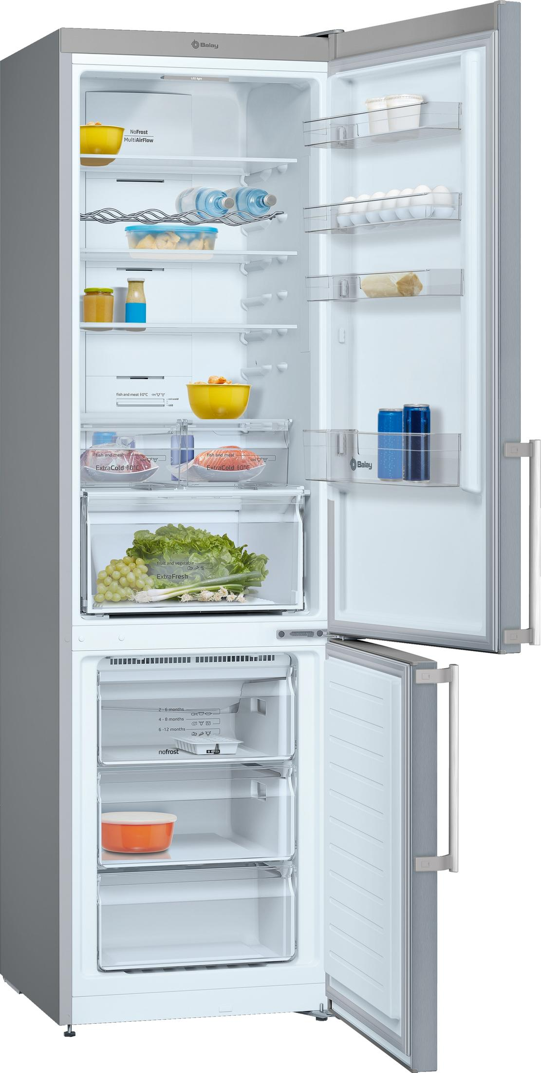 Un refrigerador abierto con comida y cajones dentro.