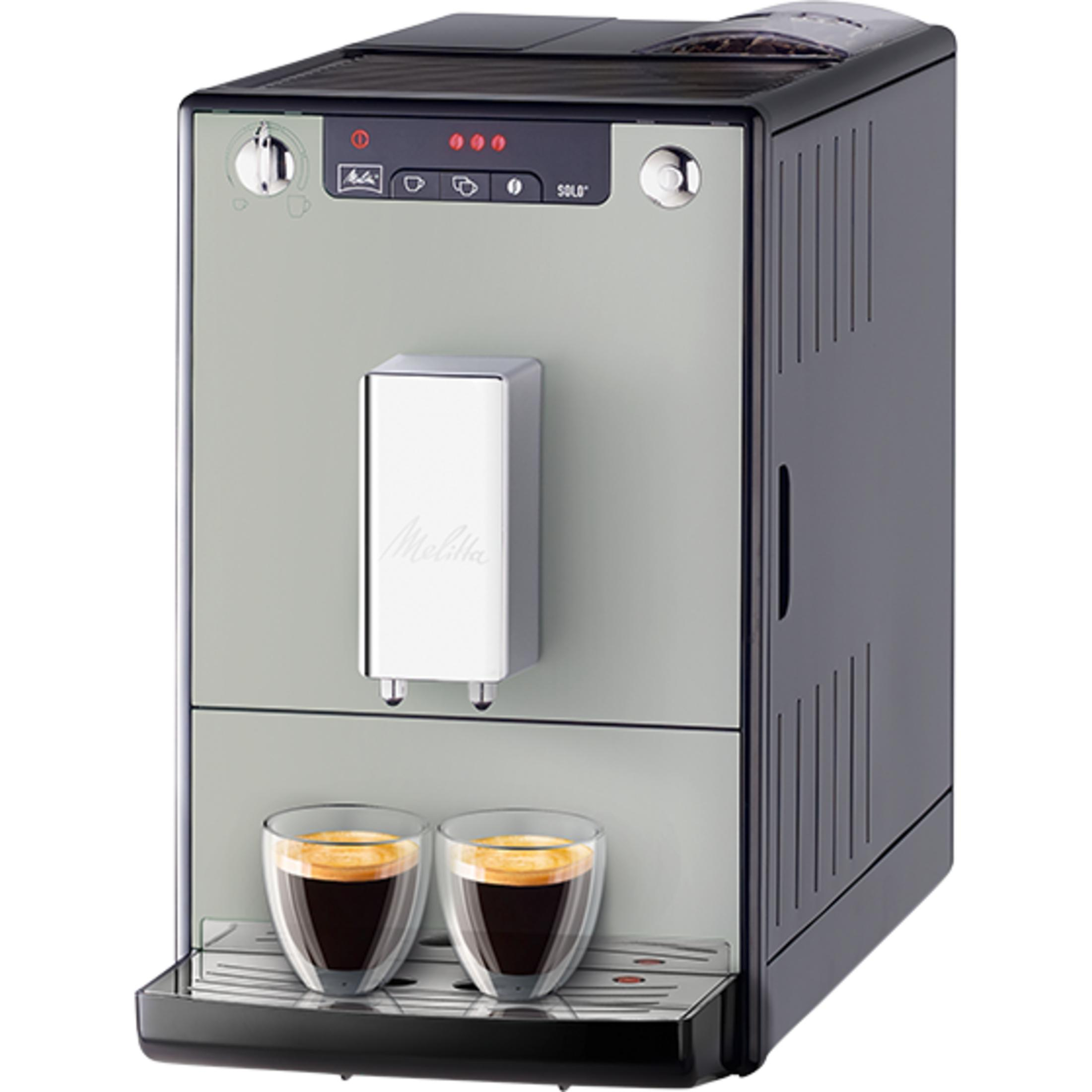 Una máquina de café con dos tazas de espresso en una bandeja de goteo.
