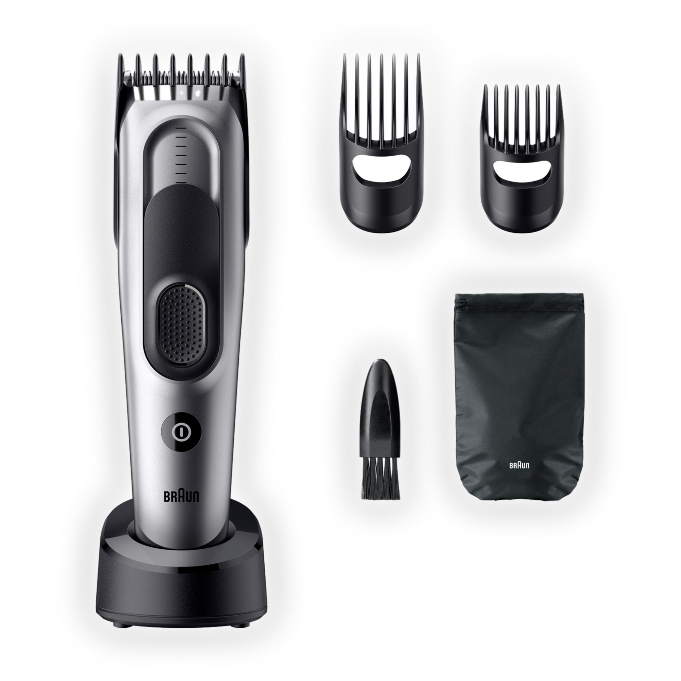 A silver and black electric shaver with charger, two guards, a brush and a pouch.