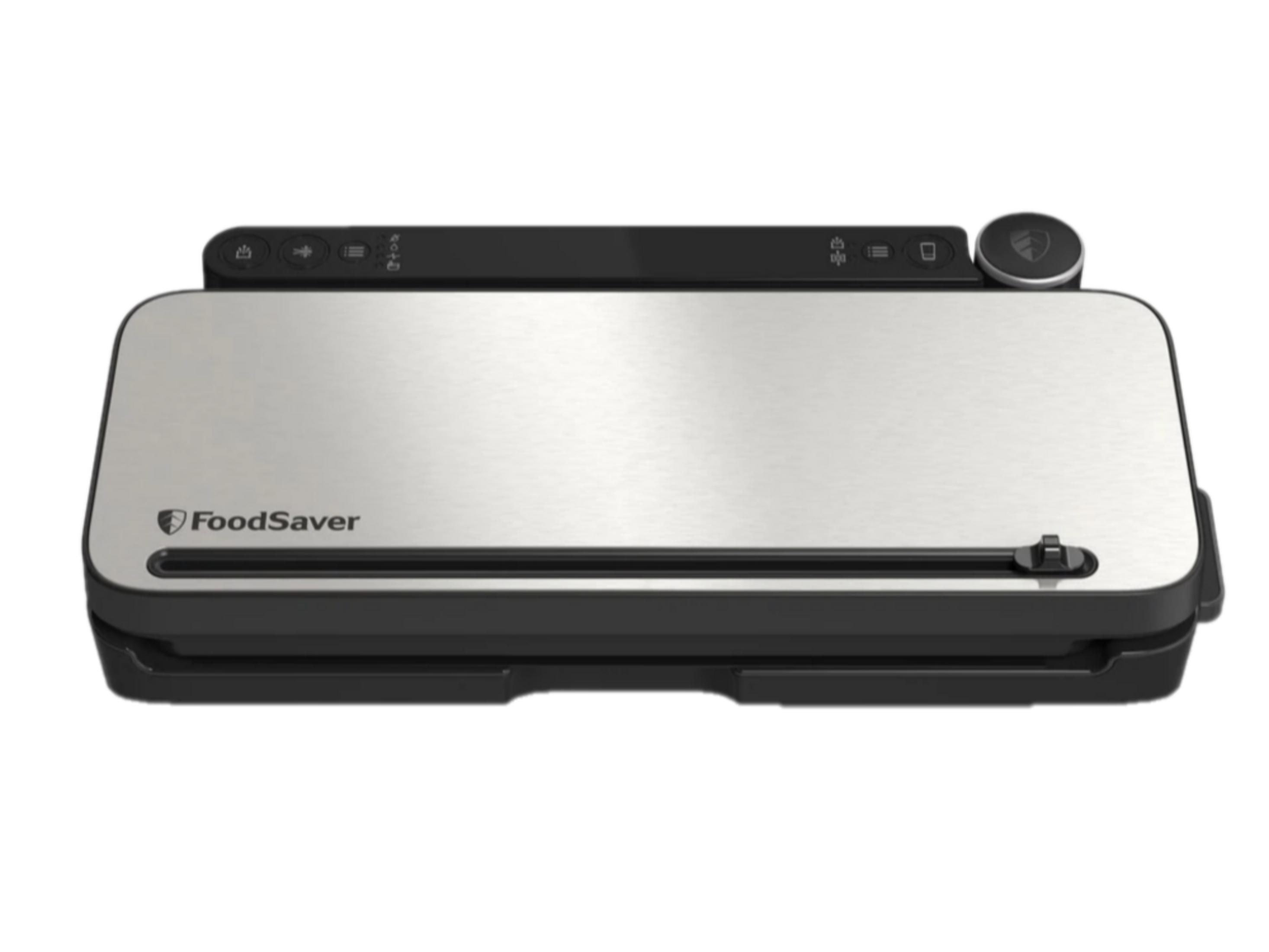 Ein silberner FoodSaver Vakuumierer mit schwarzer Oberseite und Bedienelementen.