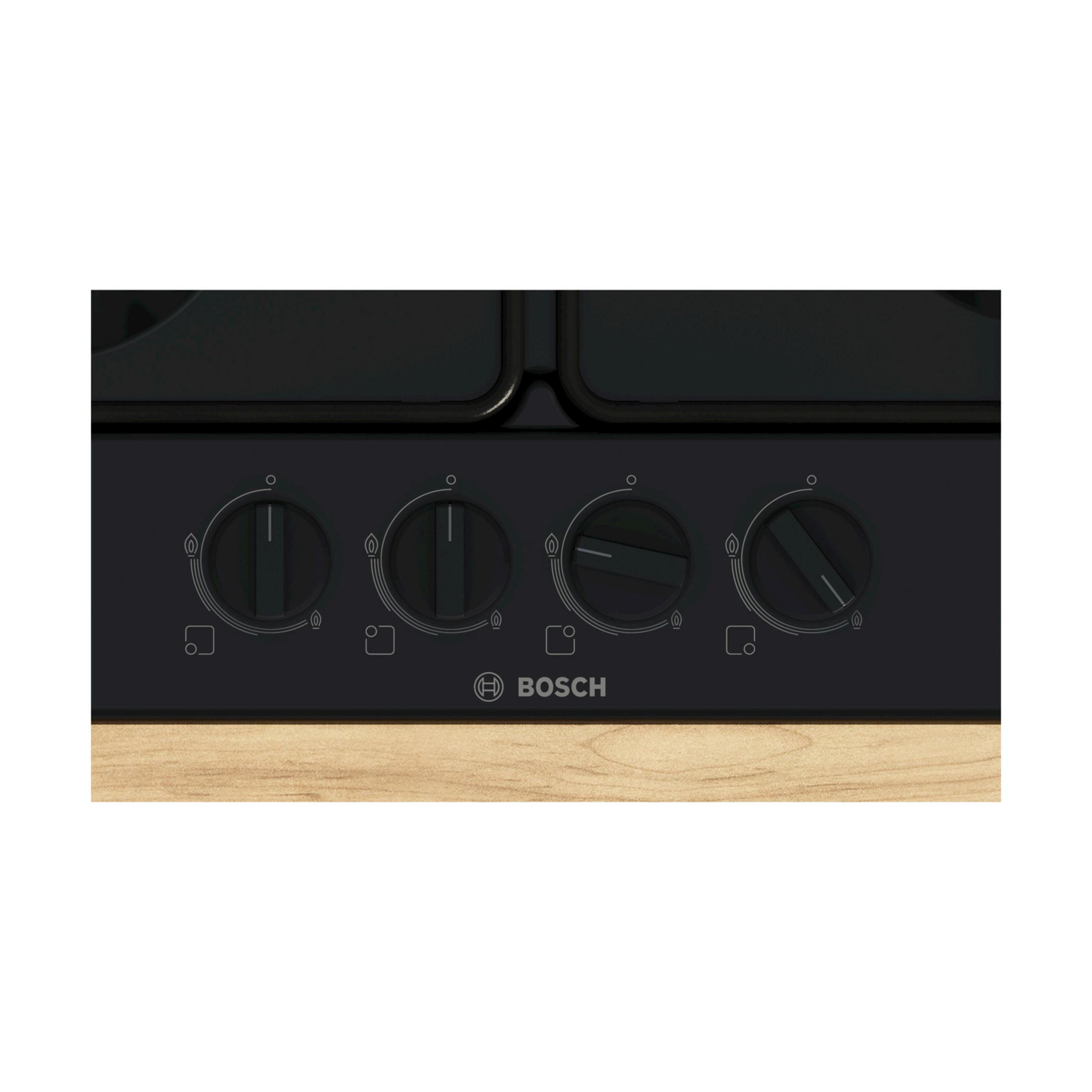 Panel de control negro de estufa de gas Bosch con cuatro perillas y base madera.