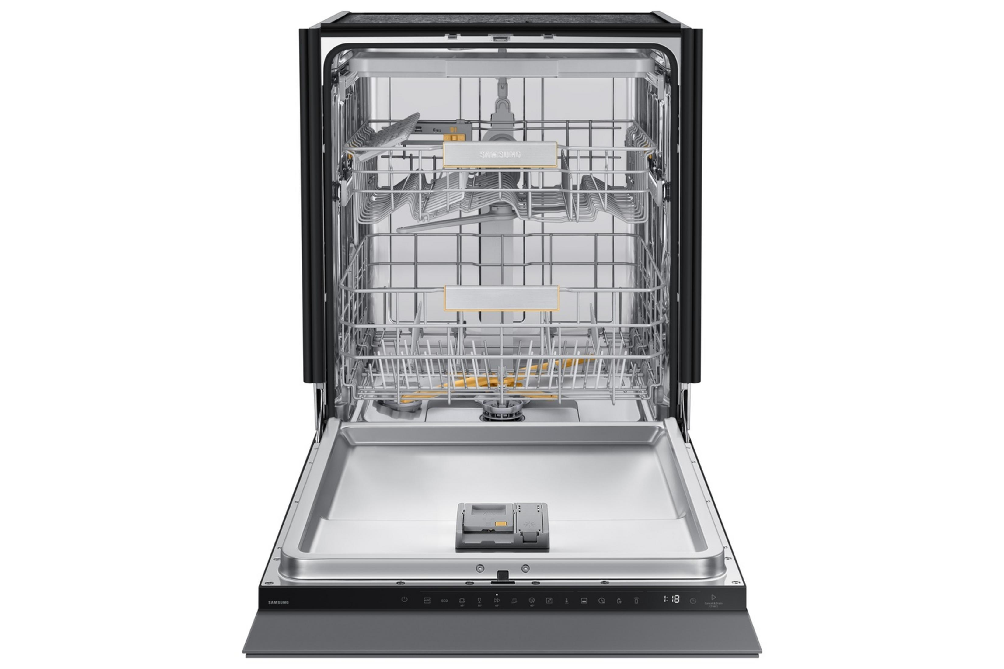 An open dishwasher with two racks and a silver interior.