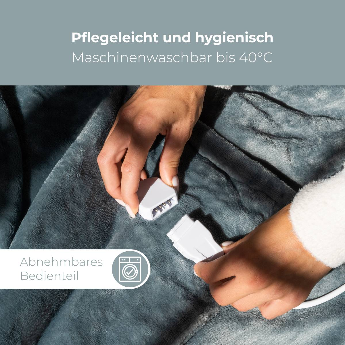 Graue Decke mit abnehmbarem Bedienelement, maschinenwaschbar bis 40°C.