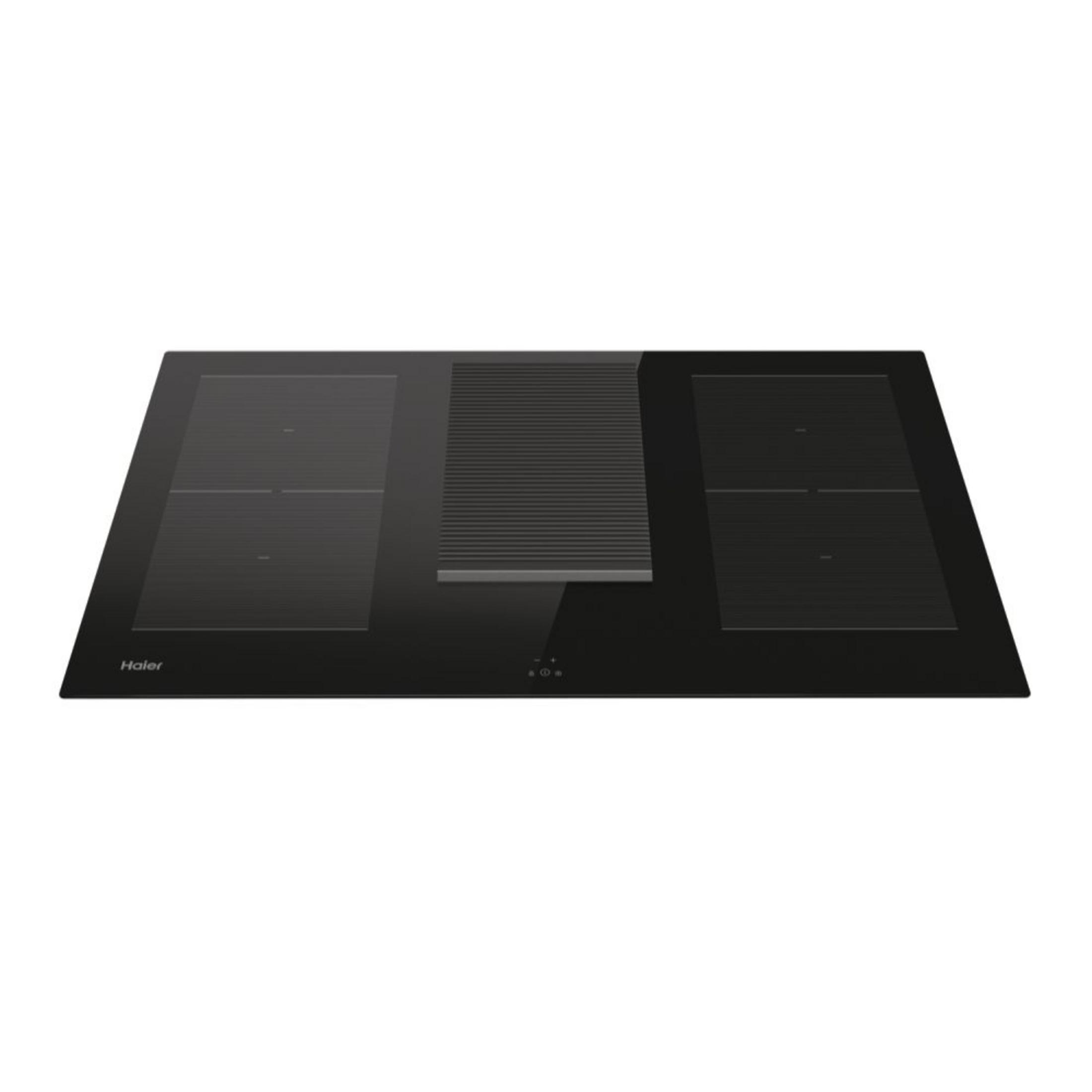 Una placa de inducción Haier negra con extractor integrado.