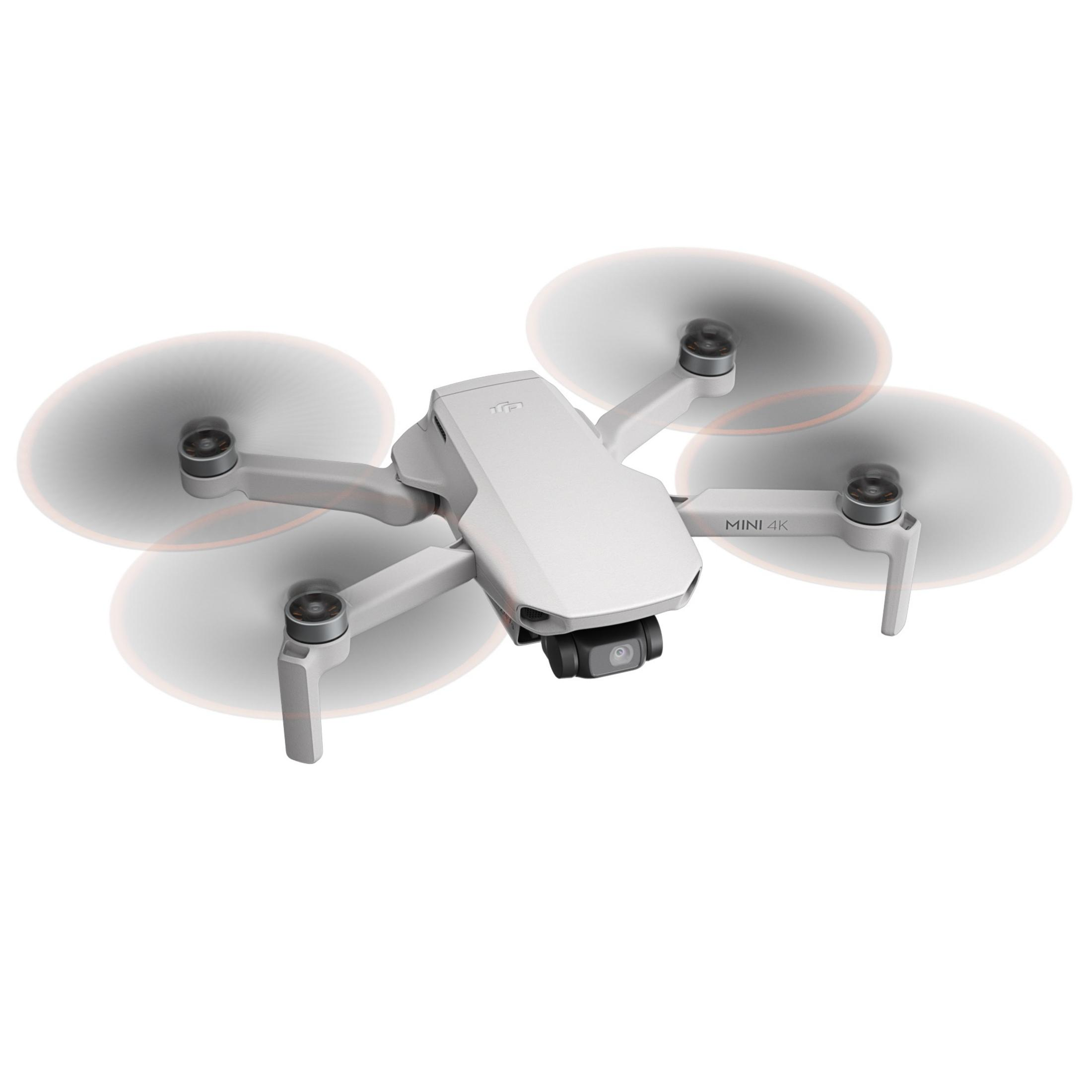 Uçan dört pervaneli küçük beyaz DJI Mini 4K drone.