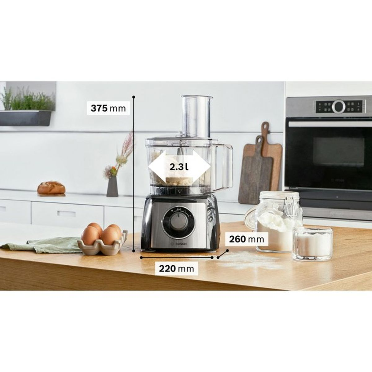 A Bosch food processor with a 2.3l capacity stands on a countertop.