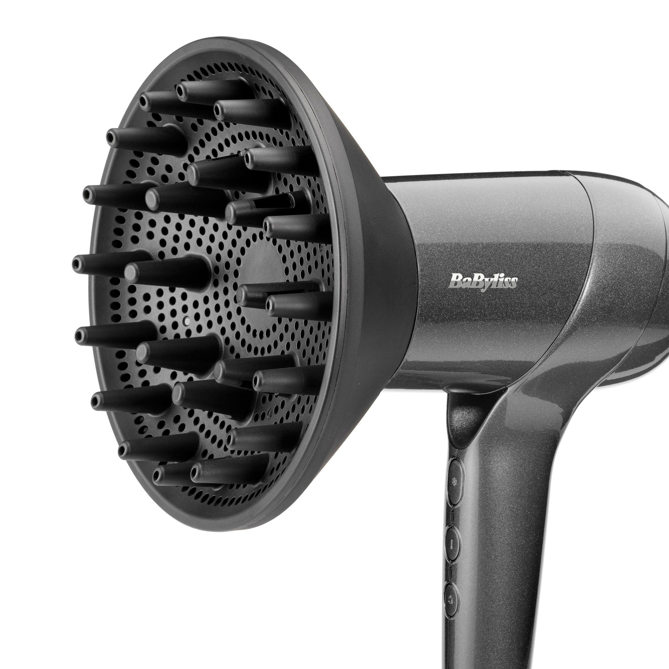Dunkelgrauer Diffusor-Aufsatz für einen Föhn, mit vielen kleinen Röhrchen.