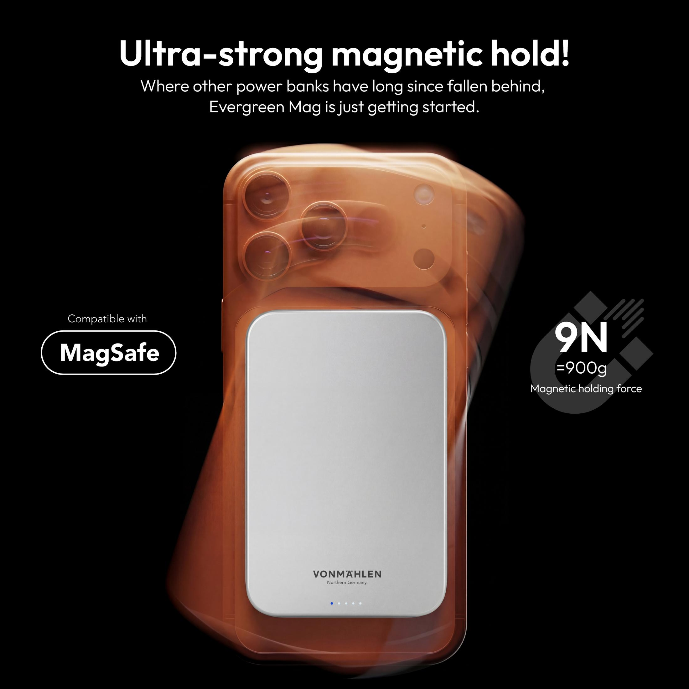 Un telefono arancione con caricatore MagSafe che mostra 9N di forza magnetica.