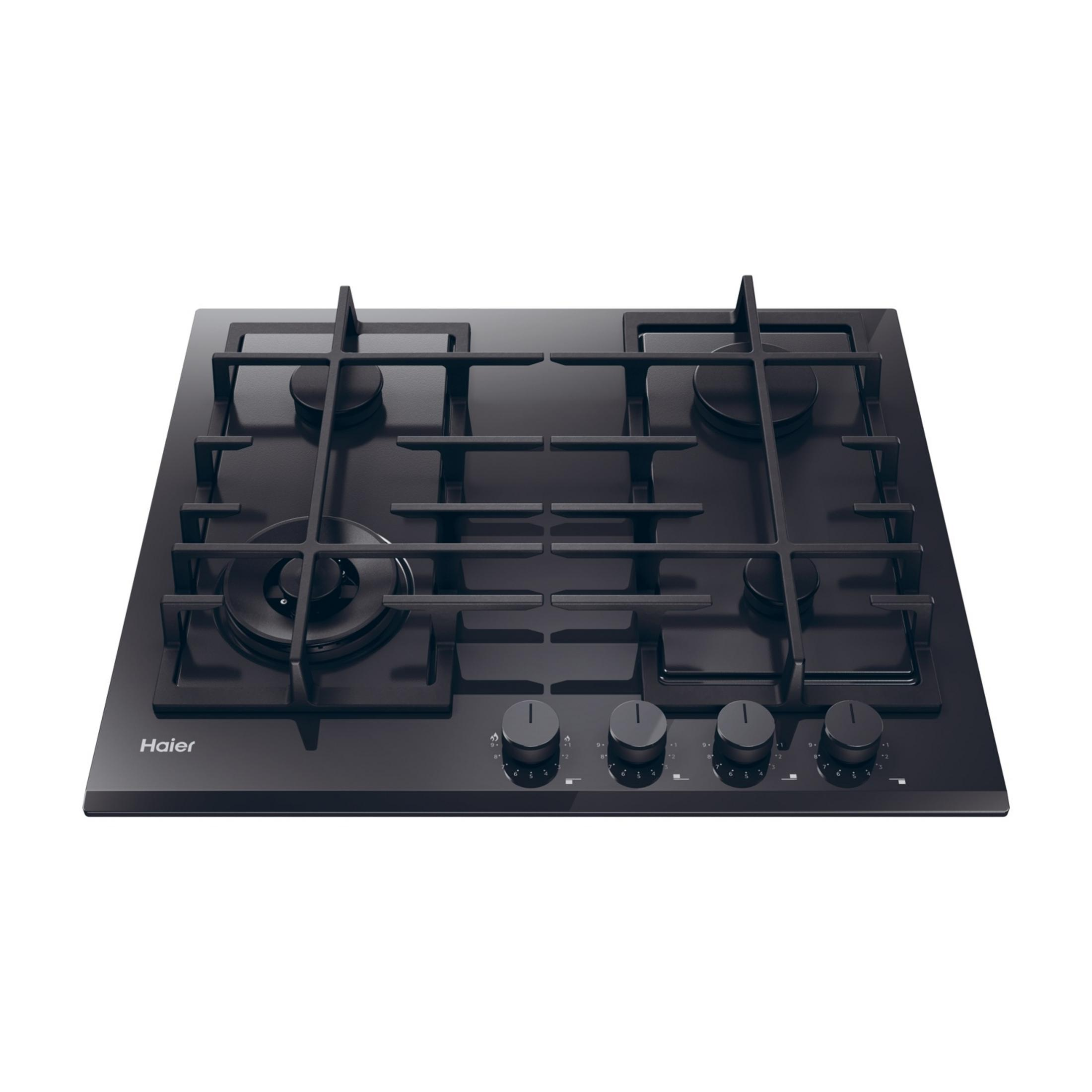 Una encimera de gas Haier negra con cuatro quemadores y perillas.