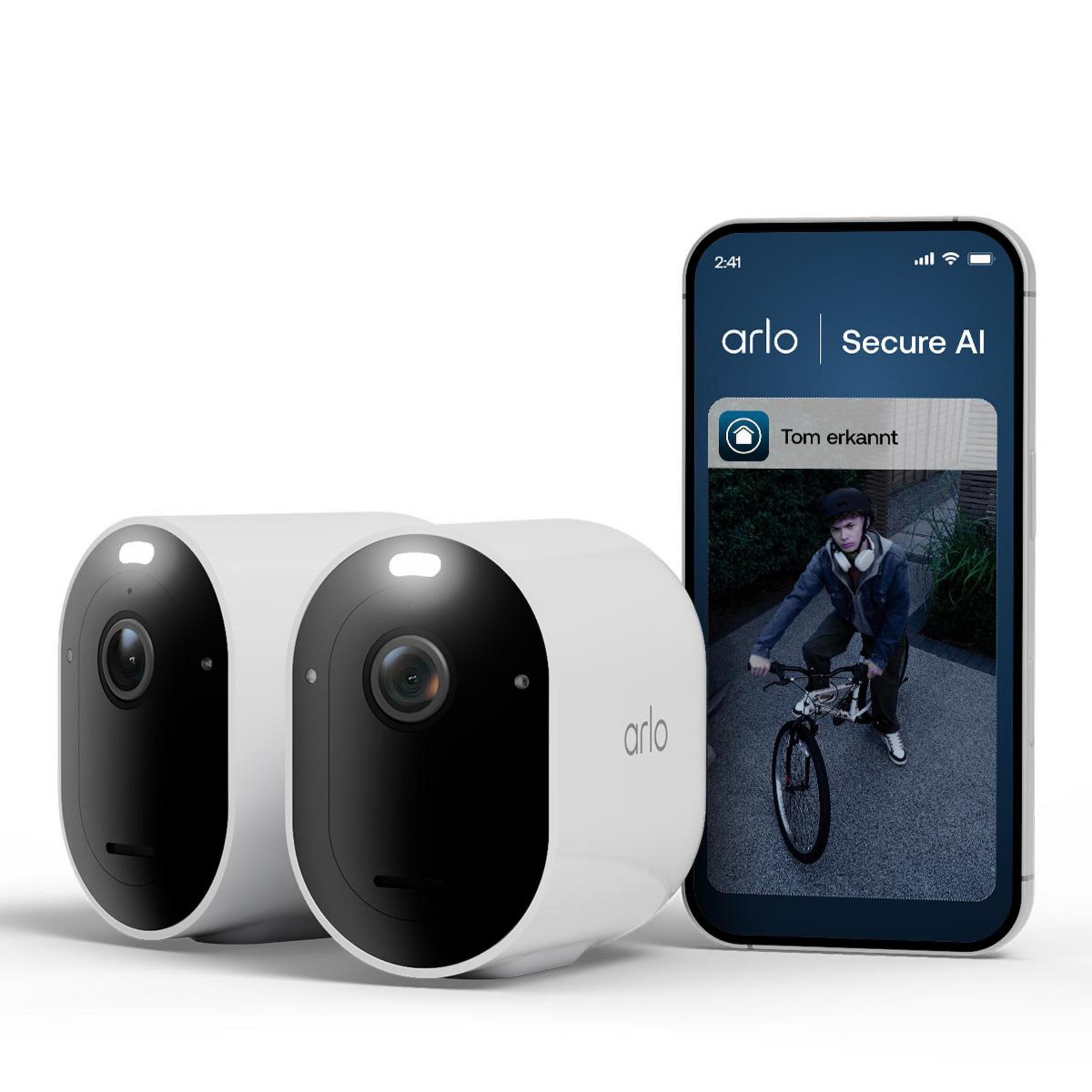 Due telecamere Arlo bianche accanto a uno smartphone che mostra una persona in bicicletta.