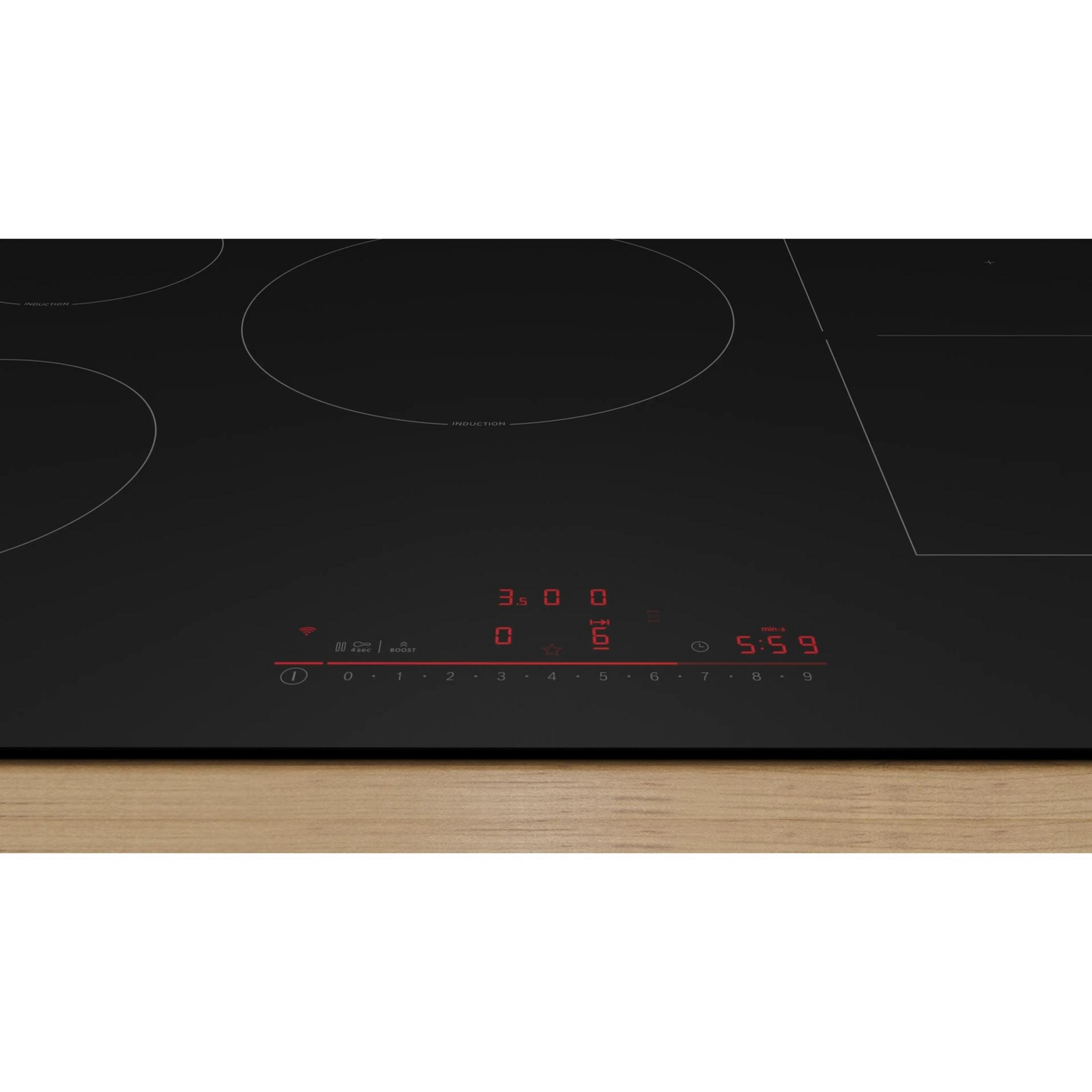 Vitrocerámica de inducción negra con pantalla digital roja y controles.