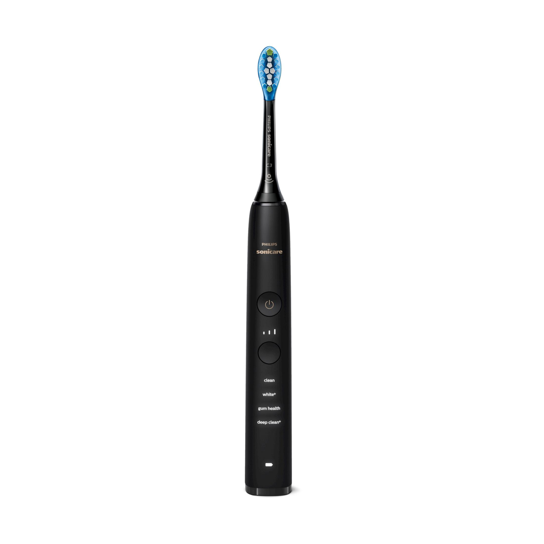 Cepillo de dientes eléctrico negro con cabezal azul y botones plateados.