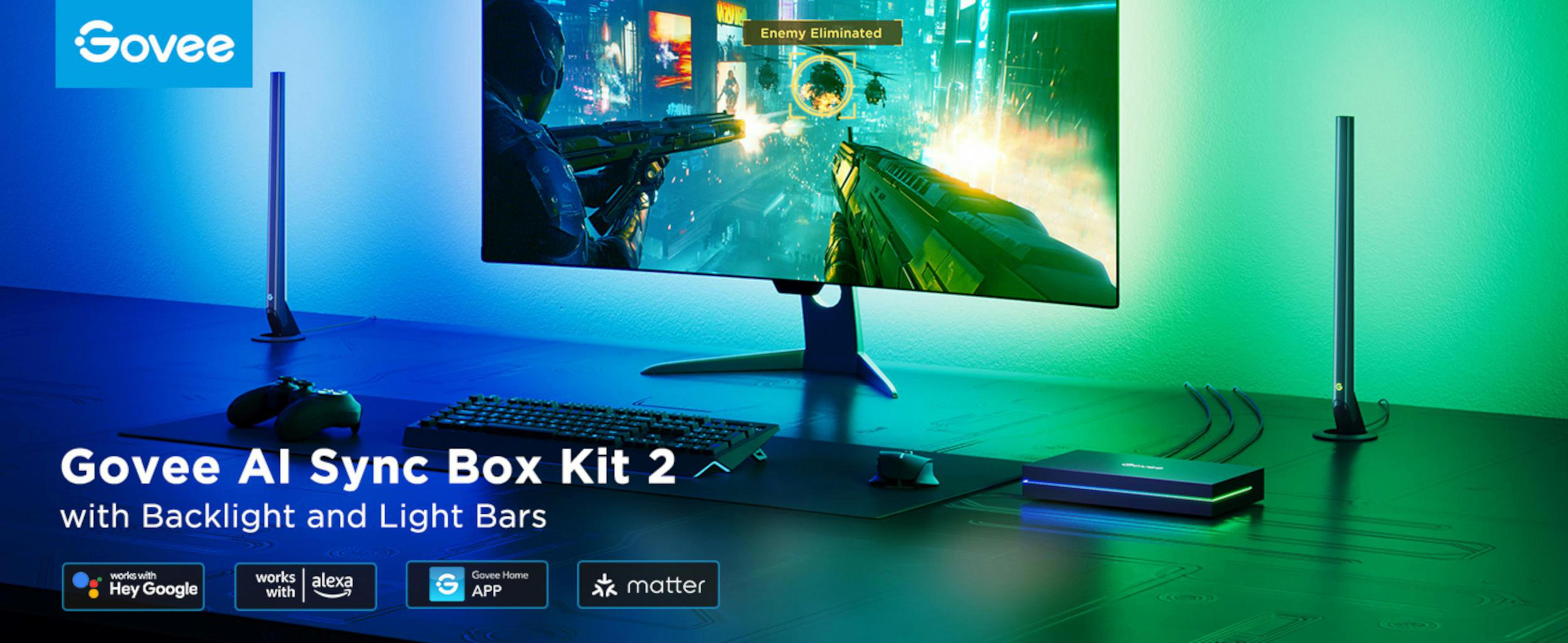 Configurazione da gioco con monitor, tastiera, mouse, controller e barre luminose Govee.