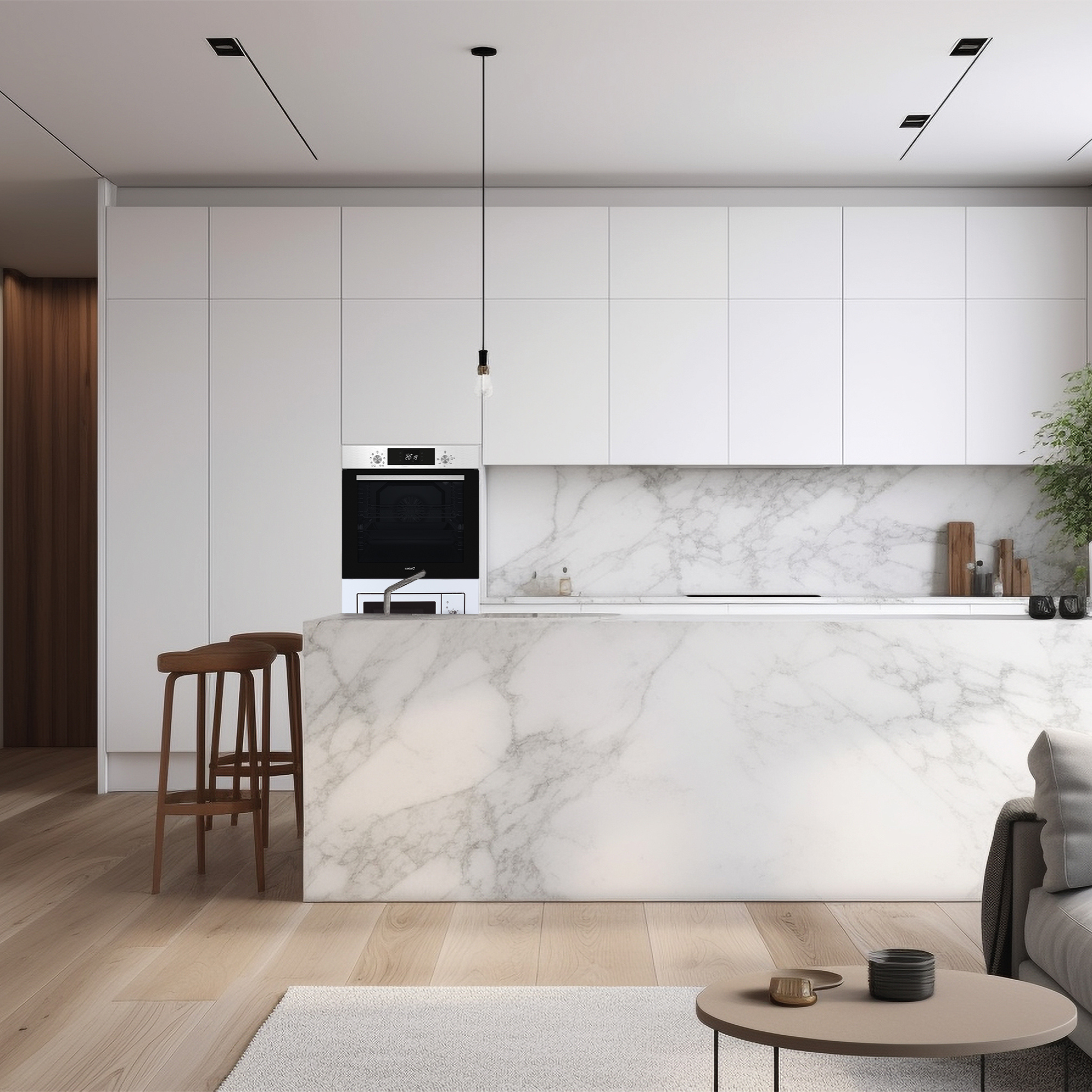 Cocina moderna con isla de mármol, suelos de madera y armarios blancos.