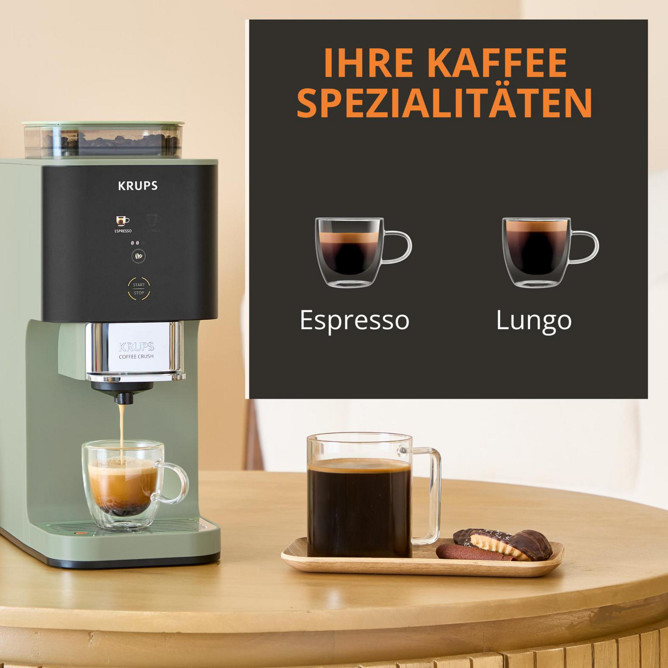 Una macchina da caffè KRUPS verde prepara un espresso in una tazza di vetro.