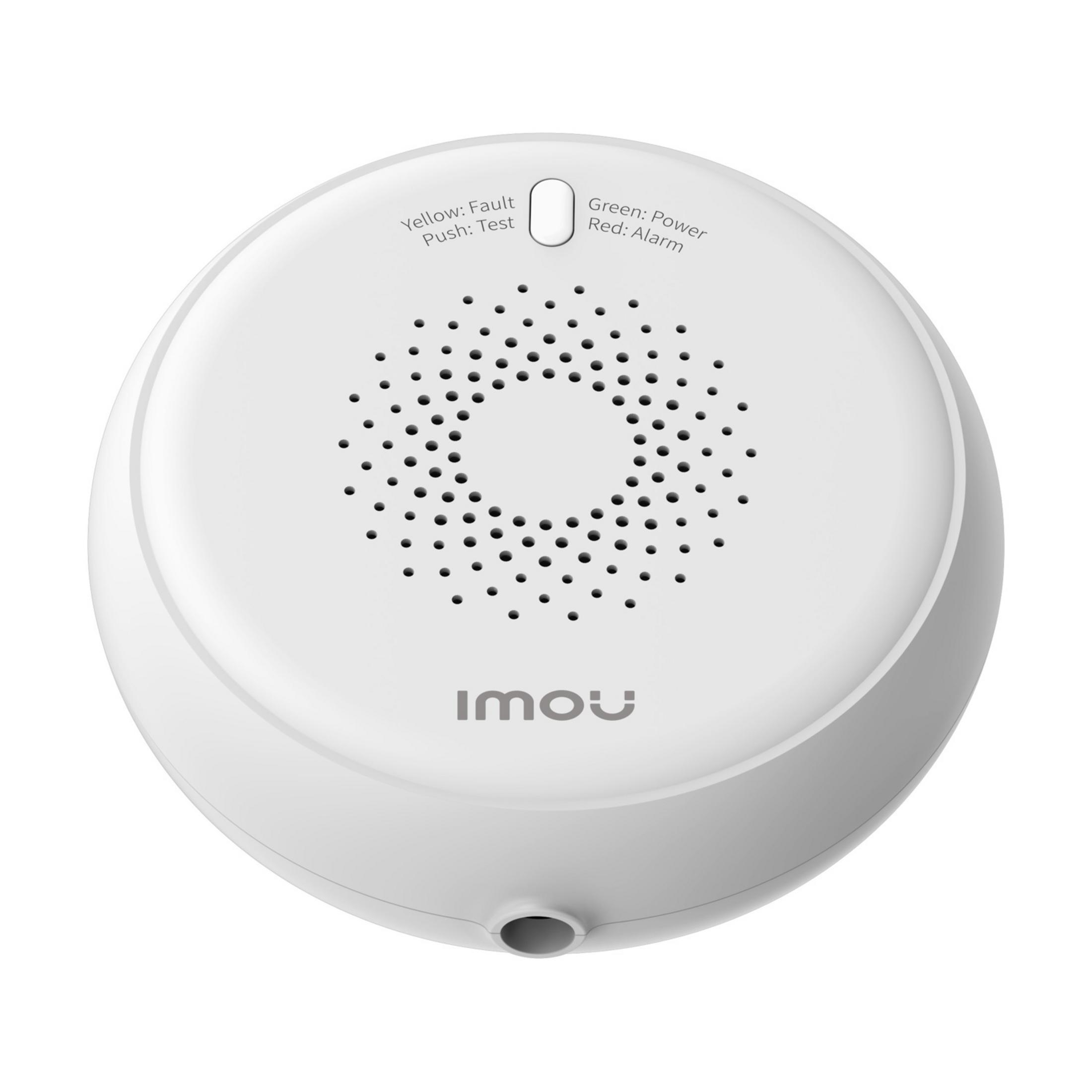 Un detector de humo blanco con rejilla de altavoz y etiquetas.