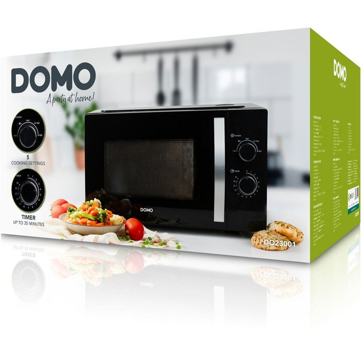 Micro-ondes DOMO noir avec réglages de cuisson et minuterie, à côté d'une assiette de légumes et petits pains.