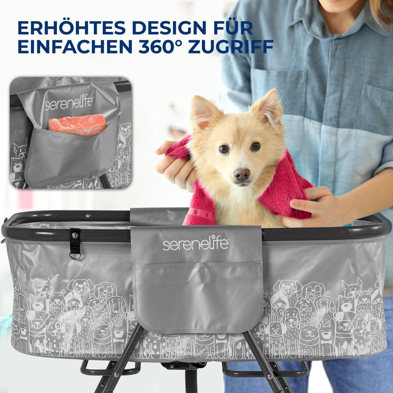 Ein Hund wird in einer grauen Wanne mit einem rosa Handtuch getrocknet.
